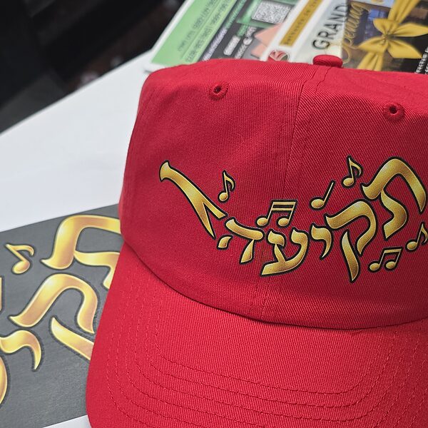 The Tekia cap, gold lettering on red